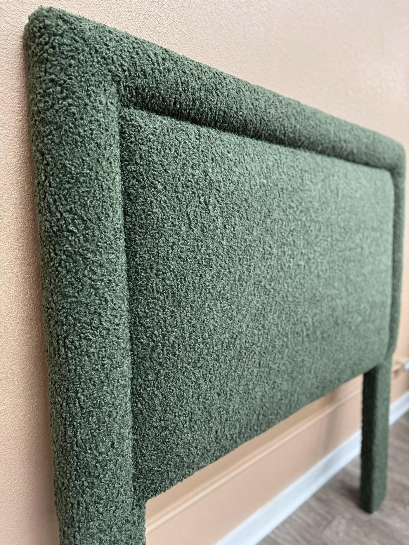Sage green boucle upholstered headboard