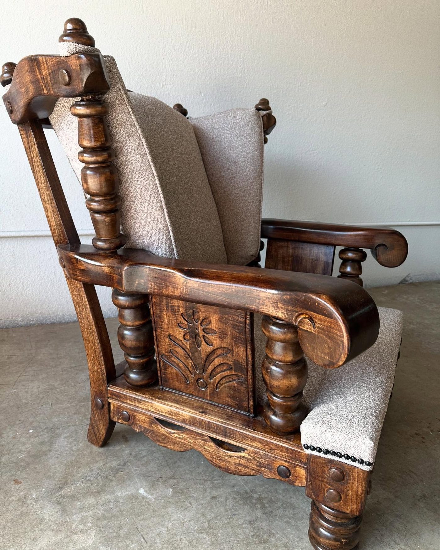 Carved wood antique armchair with new linen seat