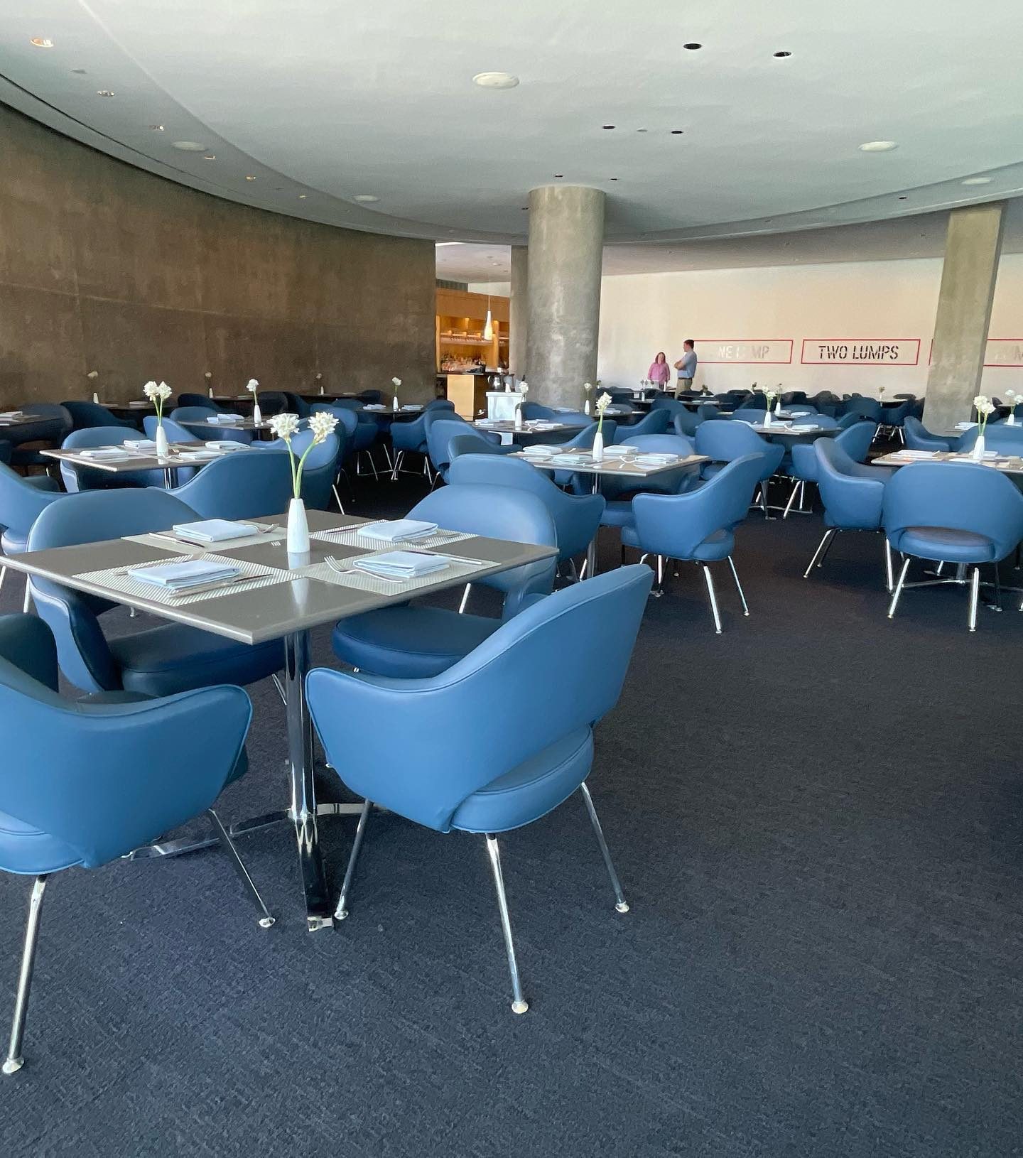 University dining hall with blue upholstered chairs