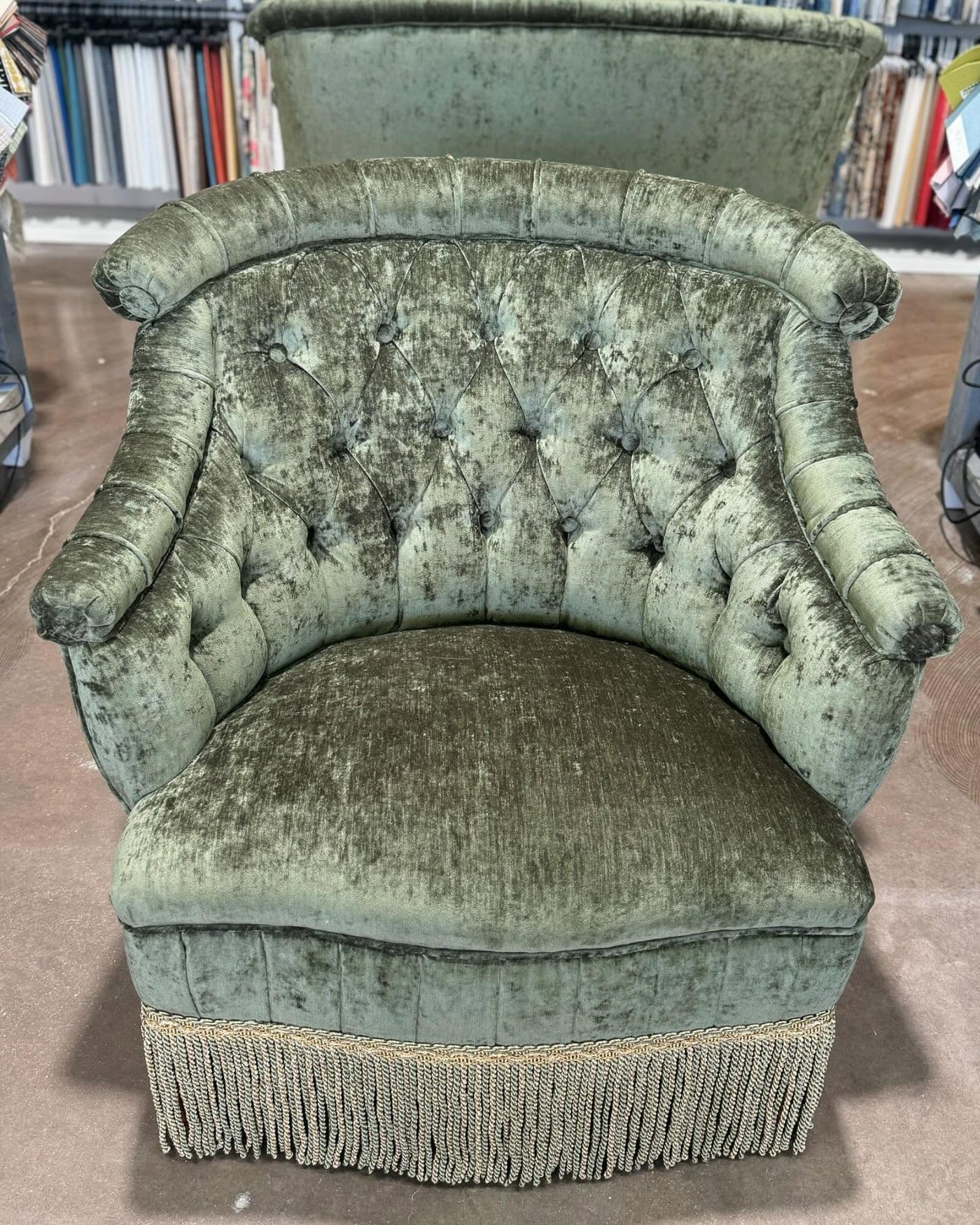Antique tufted chair in sage green velvet with bullion fringe