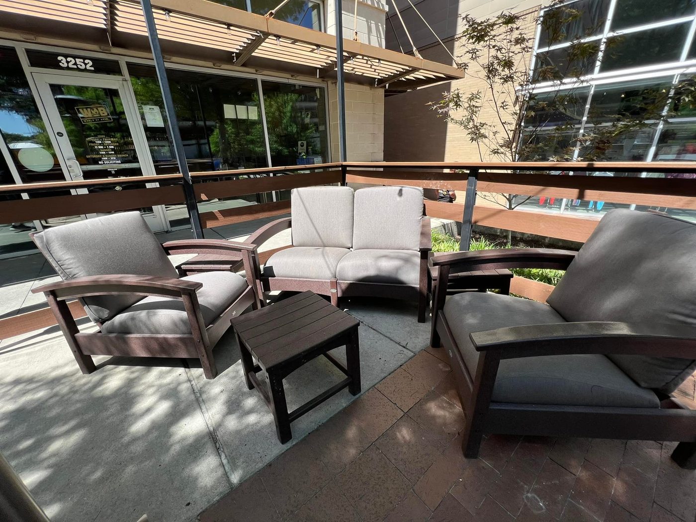 Deck furniture with grey outdoor cushions