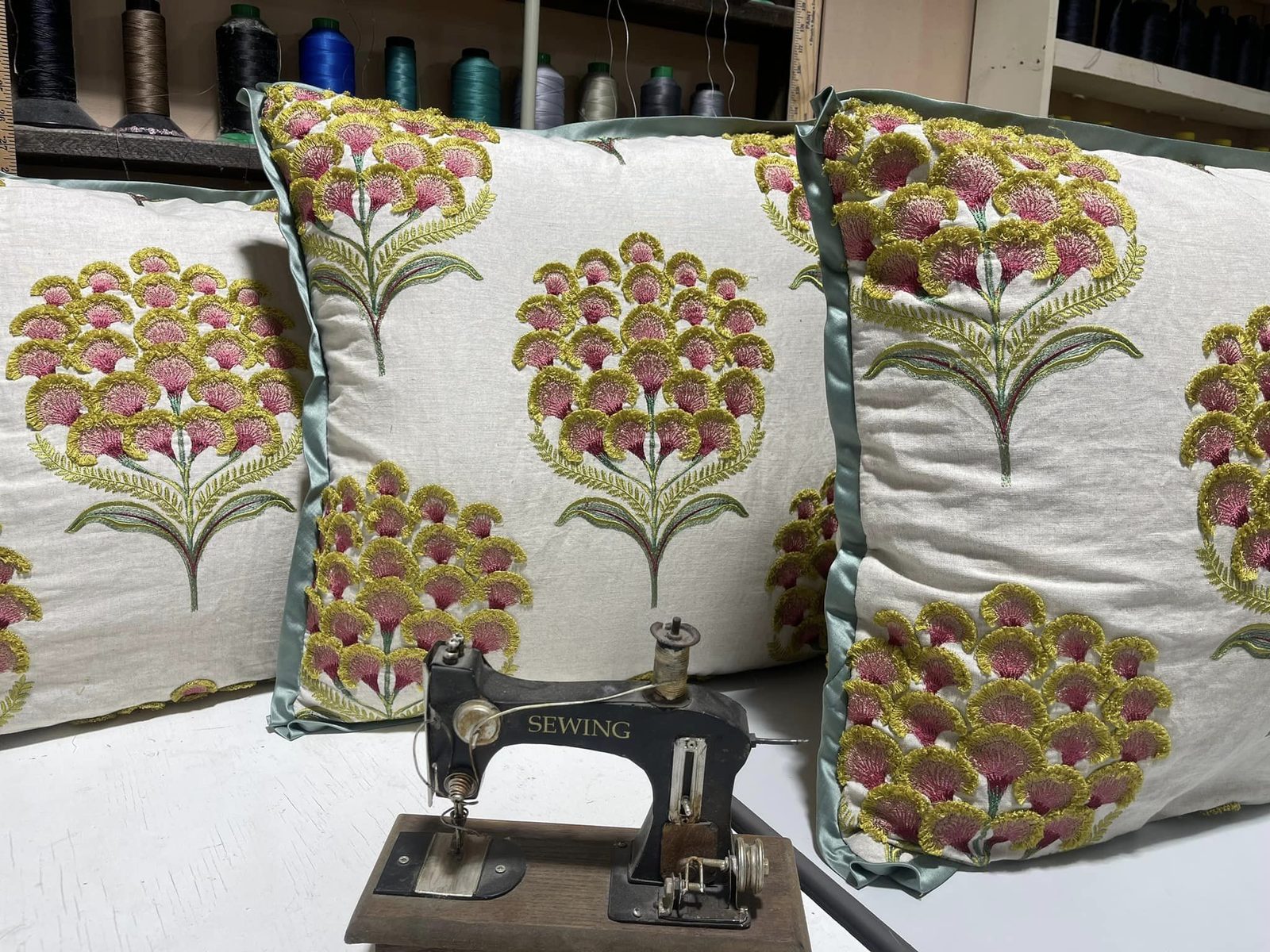 Block-print pillows beside a vintage sewing machine