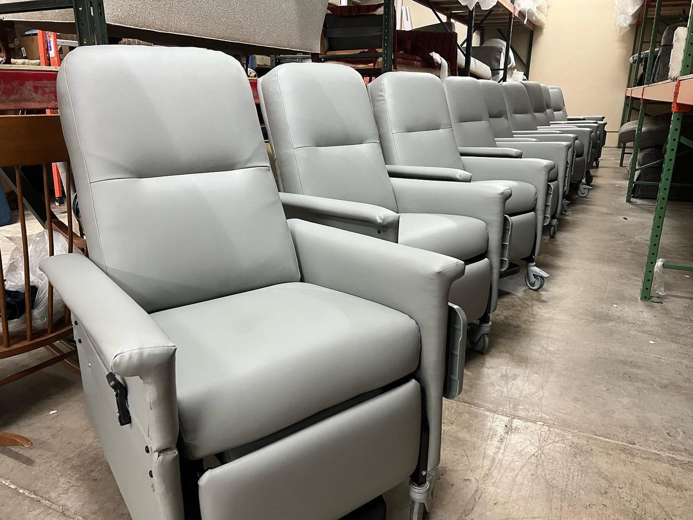 Row of medical recliners reupholstered in grey vinyl