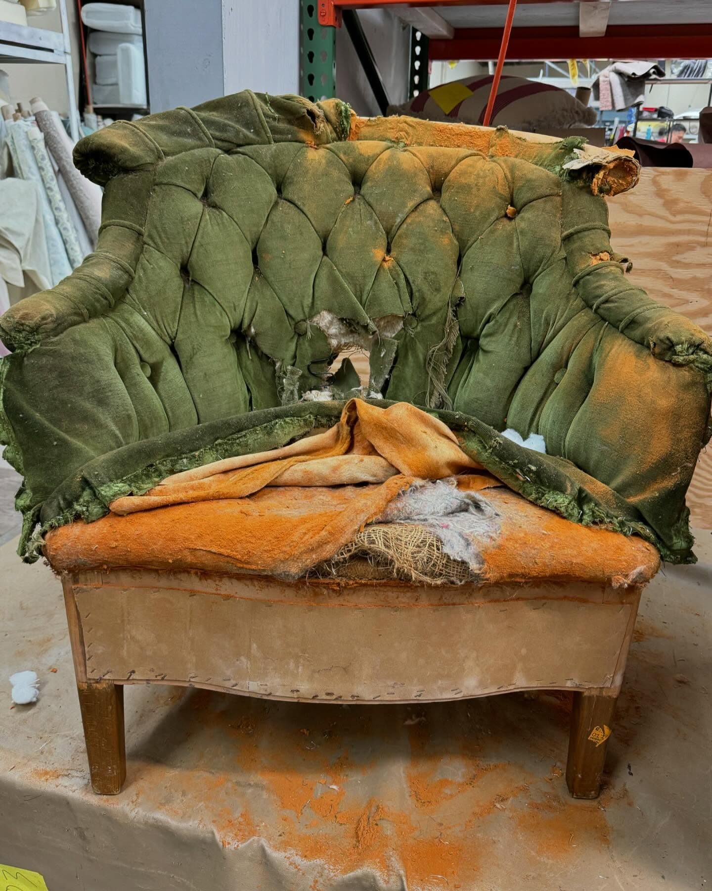 Antique chair stripped back to horsehair and burlap
