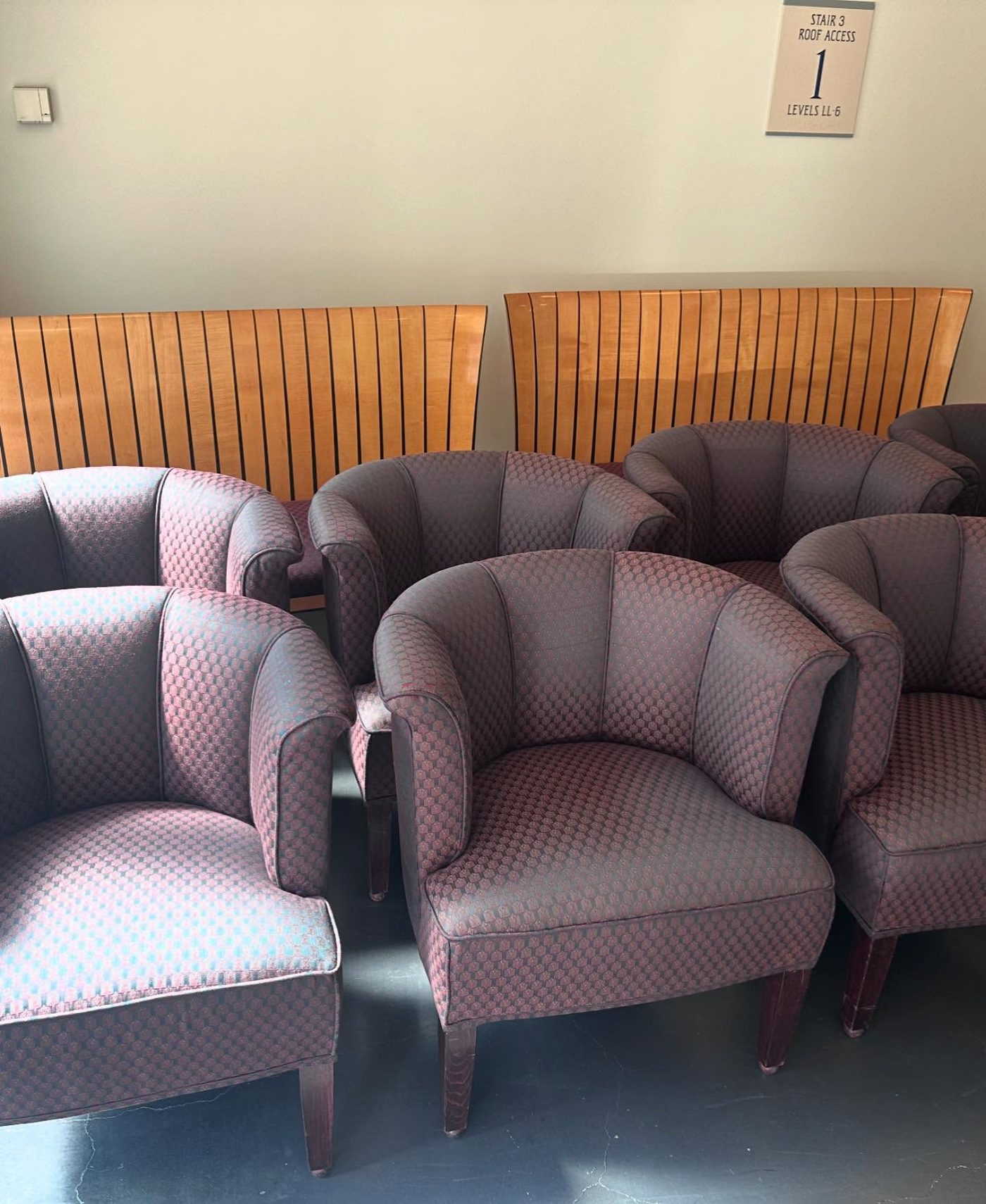 Row of waiting room chairs in rose stripe