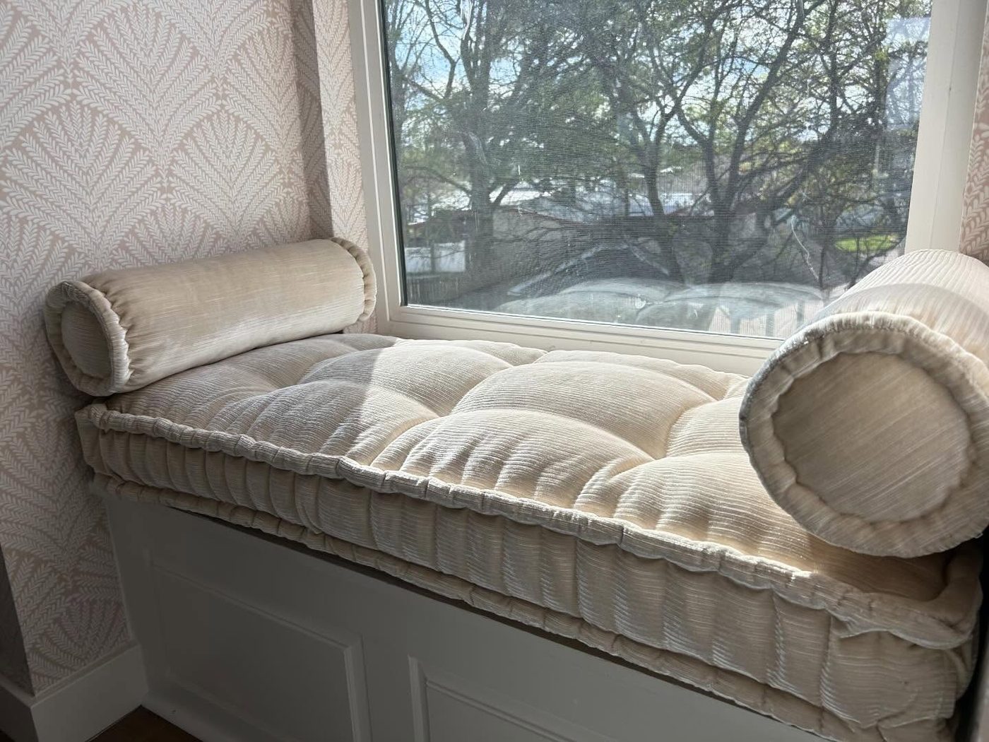 Tufted window seat cushion with bolster pillows